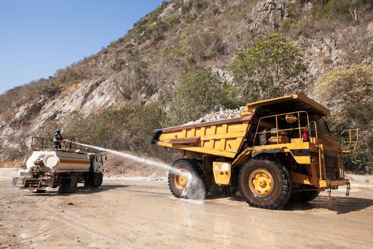 Producer Spraying Heavy Equipment