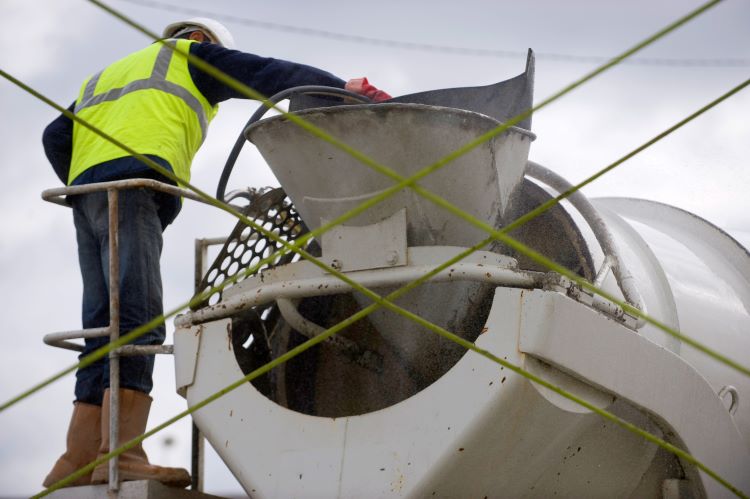 Producer Spraying Top Of Drum